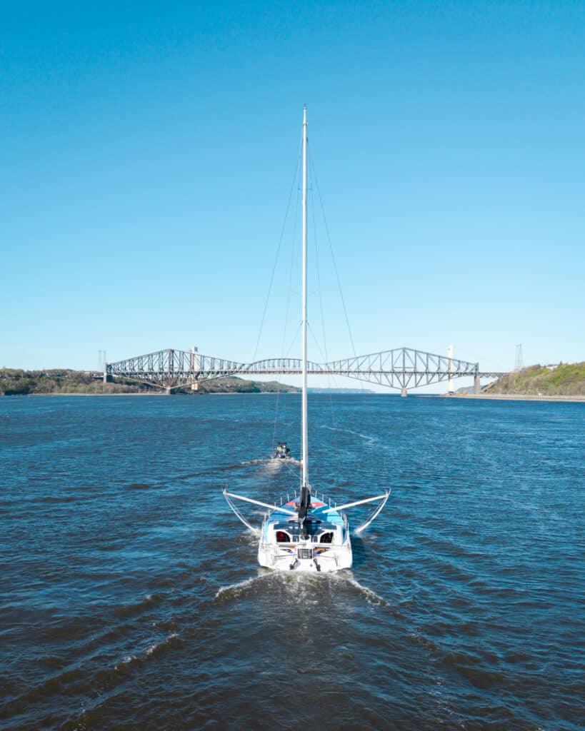 Emira IV leaves Quebec, bridge in the distance